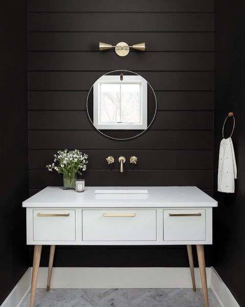 black shiplap wall white vanity mirror