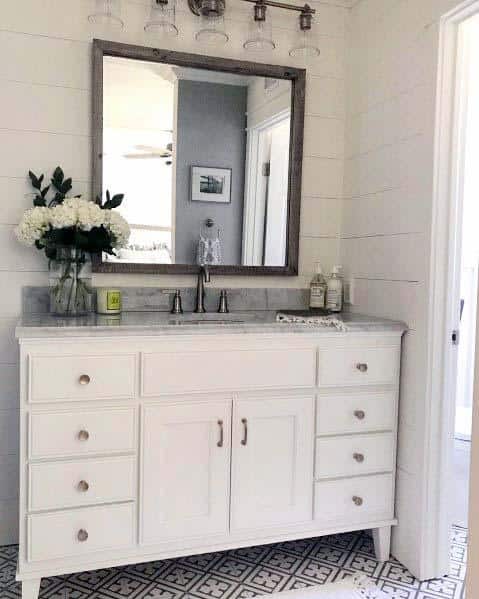 rustic mirror in shiplap bathroom