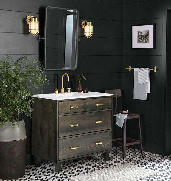 potted plants in black shiplap wall bathroom with wood vanity