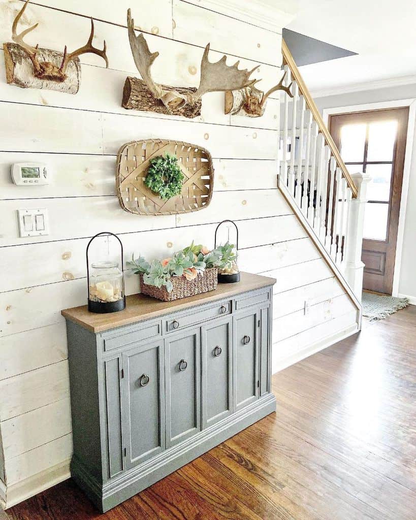 country hallway gray cabinet white shiplap wall