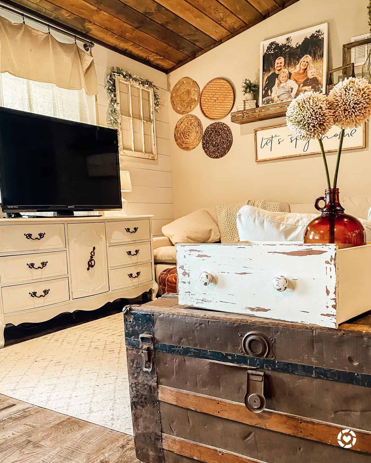 white shiplap walls farmhouse living room old chest white cabinet 