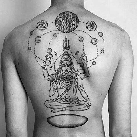 Geometric back tattoo of Lord Shiva meditating, surrounded by orbiting planets, trishul above the head, and sacred patterns across the shoulders.