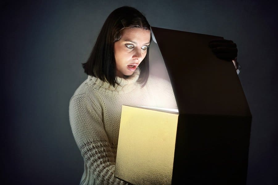 shocked woman open the box