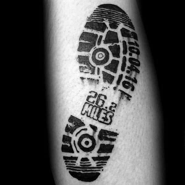 Realistic shoe print tattoo with “26.2 miles” and a race date, symbolizing the lasting impact of a completed marathon.