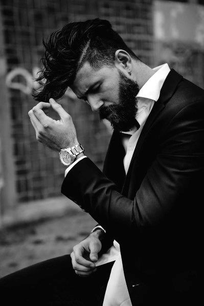 Messy, textured top with a sharp undercut and a natural side part