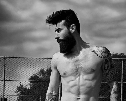 Shirtless man with voluminous, styled hair and a full beard
