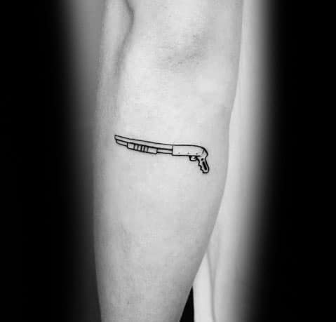 Minimalist shotgun tattoo on the arm, featuring clean black outlines for a simple yet bold design.