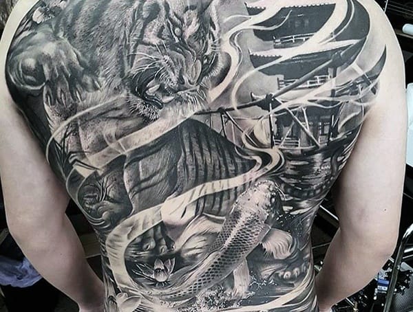 Full back tattoo featuring tiger, fish, and swirling patterns in black and gray ink