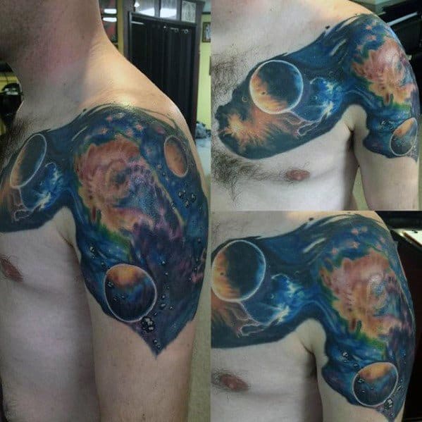 Vibrant outer space featuring nebula with planets gracing a shoulder and upper arm