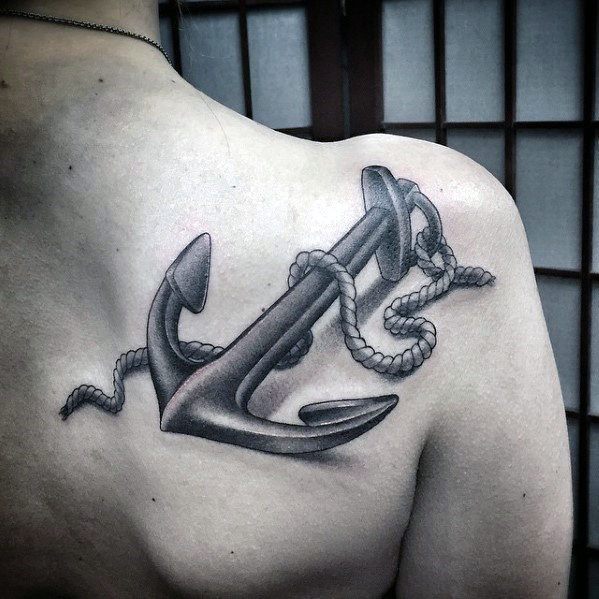 Realistic anchor tattoo with rope on a person's shoulder 