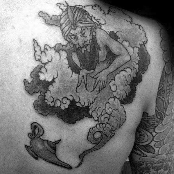 Black and gray tattoo of a genie emerging from a lamp in a cloud of smoke, featuring detailed shading