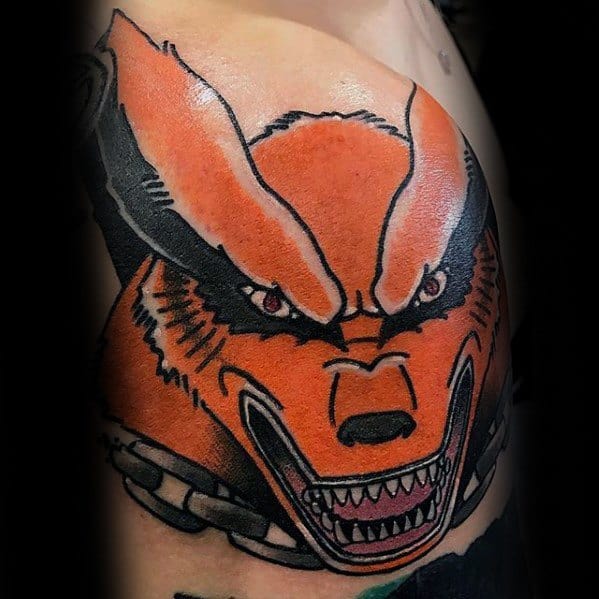 A vibrant tattoo of Kurama, the Nine-Tails fox from Naruto, with an intense expression and bold orange and black colors