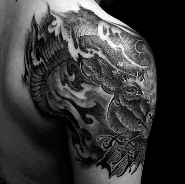Black and white shoulder tattoo featuring a detailed sheep with flames