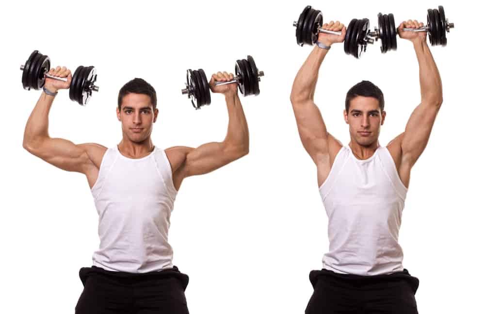 young man doing seated dumbbell shoulder press exercise