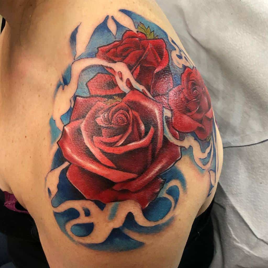 Vibrant red roses with flowing blue and white elements, beautifully covering the shoulder area