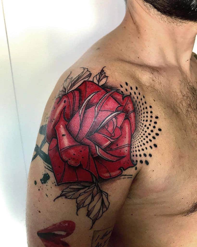 A tattoo of a vibrant red rose graces the man's shoulder, enhanced by intricate artistic shading