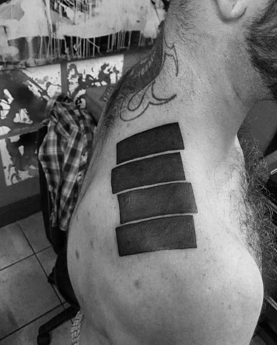 Three large Black Flag bars tattooed on the shoulder blade, each slightly curved and spaced apart for a bold, deconstructed punk look.