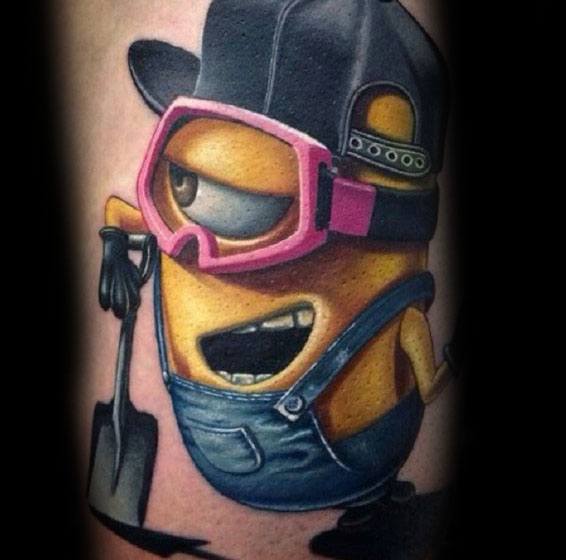 Colorful tattoo of a playful Minion wearing a backward cap, pink goggles, and denim overalls, holding a shovel with a mischievous expression.