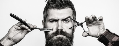 Bearded man, bearded male. Portrait of stylish man beard. Barber scissors and straight razor, barber shop. Vintage barbershop, shaving. Black and white