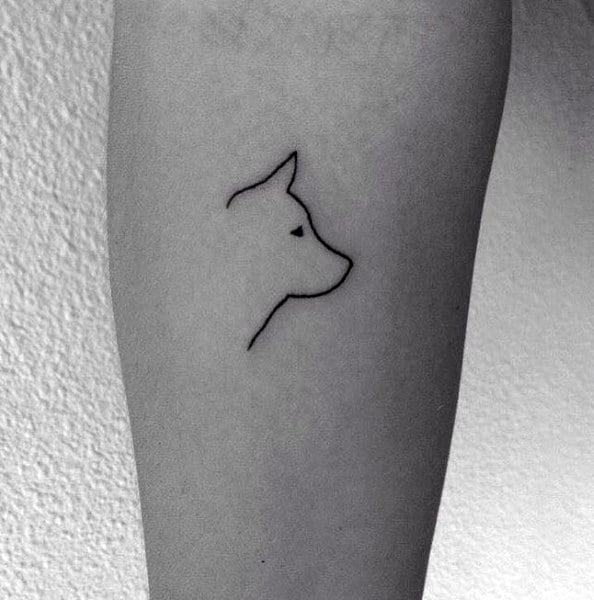 Minimalist Siberian Husky tattoo on a person's arm, featuring a simple one-line outline of the dog's head for a sleek and subtle design.