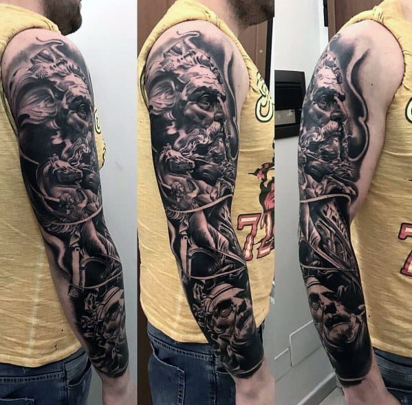 Black and grey full-sleeve tattoo featuring a highly detailed Greek mythology theme with a powerful god-like figure, dynamic shading, and intricate details.