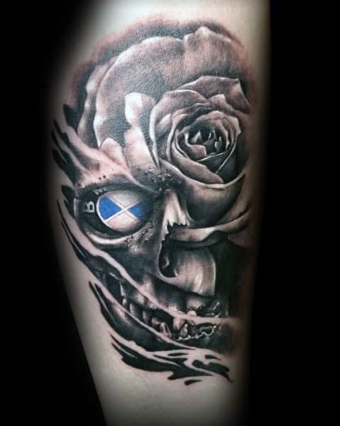 Bold BMW-themed tattoo featuring a skull with a BMW logo eye and a detailed rose, blending automotive and gothic elements in a striking design.