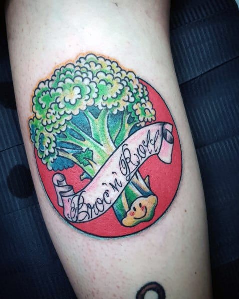 Colorful broccoli tattoo with a bold red background, featuring a banner that reads "Broc’n Roll" for a fun and playful design.