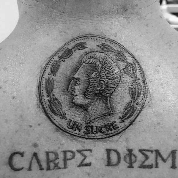 Realistic tattoo of an Ecuadorian 'Un Sucre' coin on the upper chest, featuring intricate shading and fine details for a three-dimensional effect.