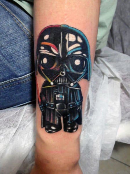 Tattoo of Stewie Griffin from Family Guy dressed as Darth Vader in a Funko Pop-style design, featuring glossy black armor and vibrant reflections.