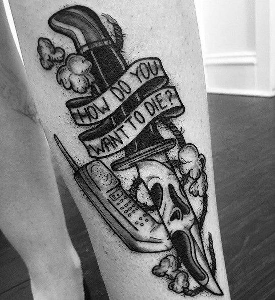 Black and grey tattoo inspired by *Scream*, featuring a dagger, Ghostface mask, vintage phone, and a banner with the chilling phrase "How do you want to die?"