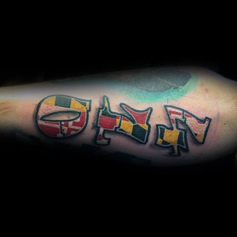 "410" tattoo on the forearm filled with the Maryland flag pattern, showcasing Baltimore pride with bold colors and a graffiti-style font.