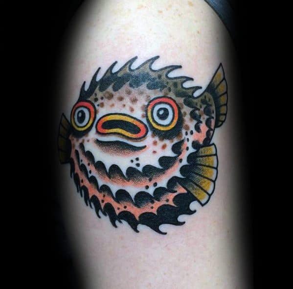 Traditional pufferfish tattoo with bold black outlines, vibrant orange and yellow accents, and a stylized wave-like border for a dynamic look.