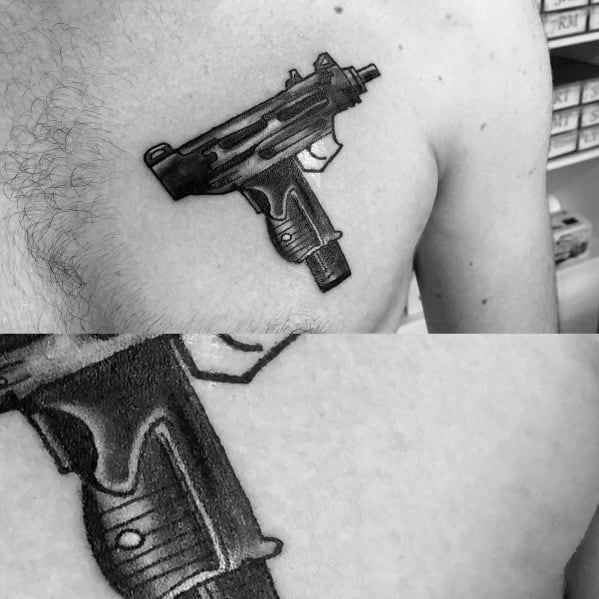 Realistic black and grey Uzi tattoo on the upper chest with fine shading and intricate details, creating a bold and striking firearm design.