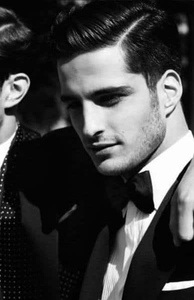 Classic, sleek side part with a polished finish and medium length