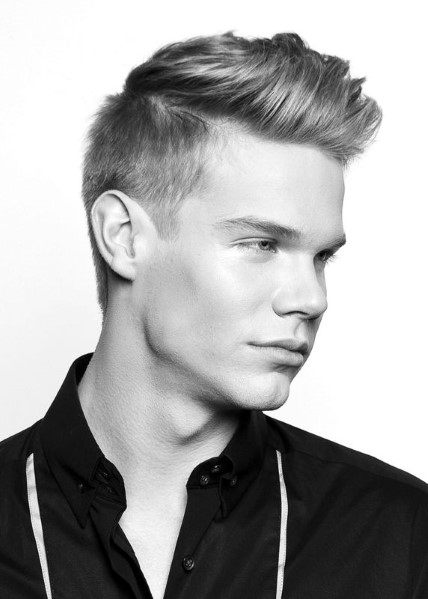 Textured quiff with a subtle side part and a clean fade
