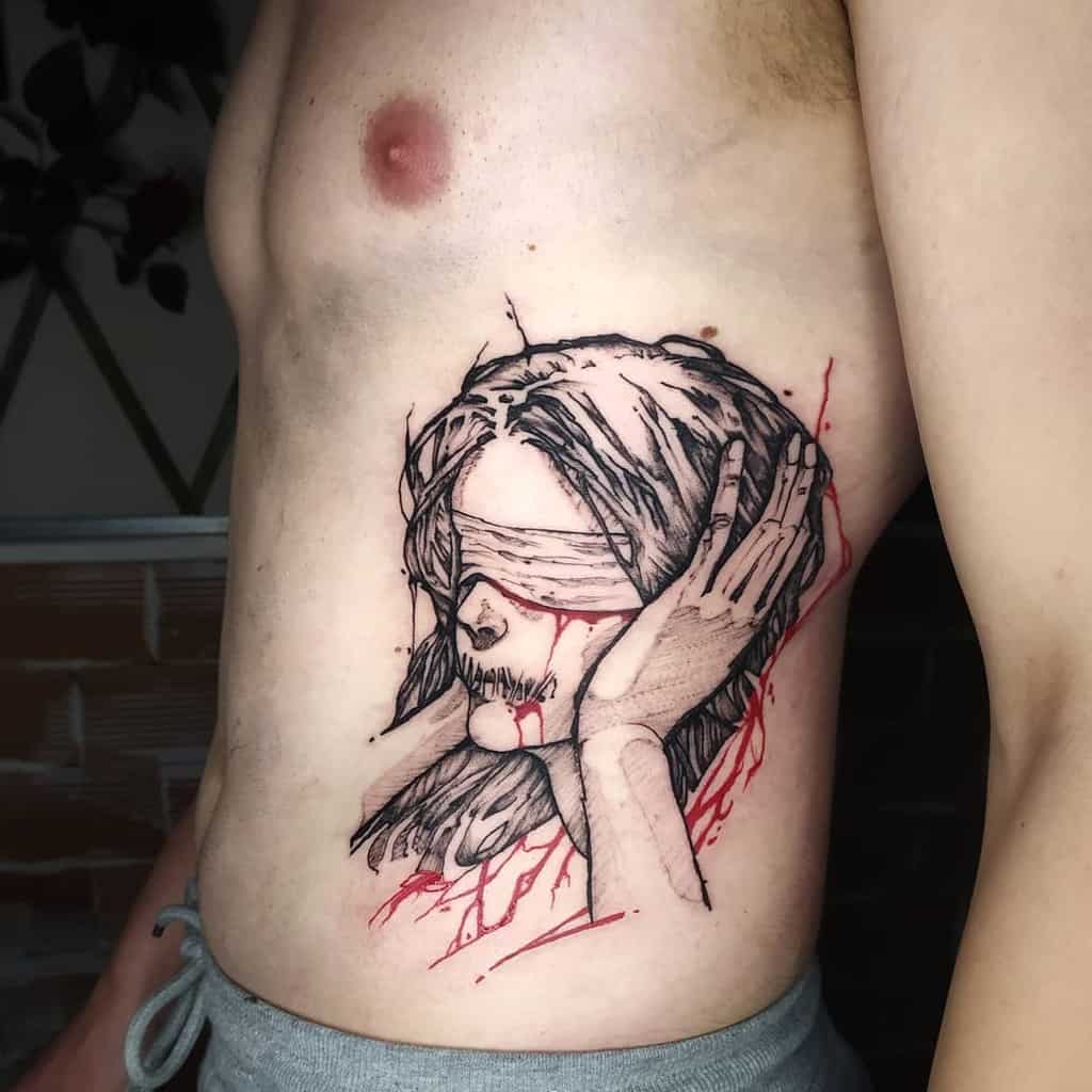 Side profile of a person with a tattoo featuring a blindfolded figure and red accents on their ribcage
