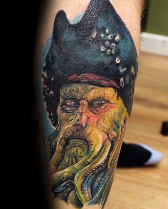 Color tattoo of Davy Jones, a fictional pirate with tentacles, gracing a person's leg