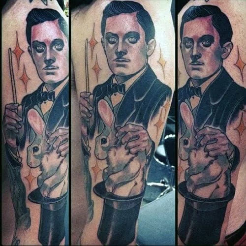 Tattoo of a magician pulling a rabbit out of a top hat, holding a wand, with sparkles in the background