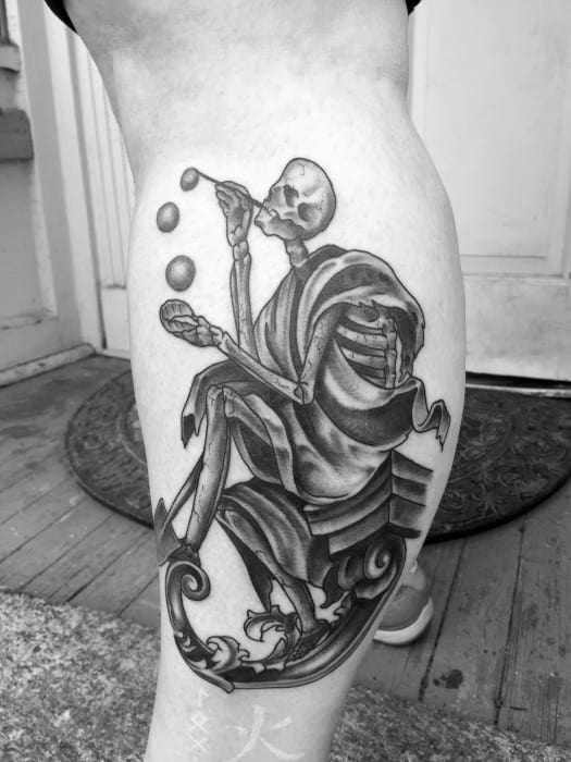 Black and grey tattoo of a skeleton sitting and blowing bubbles, with intricate shading and flowing lines, creating a whimsical and surreal scene.