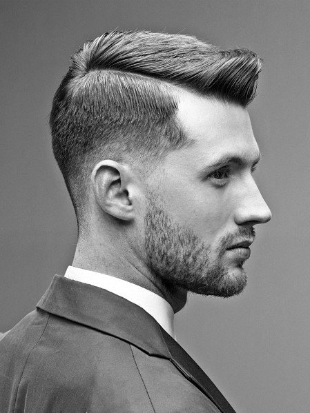 Sharp side part with a hard part and a clean, tapered fade