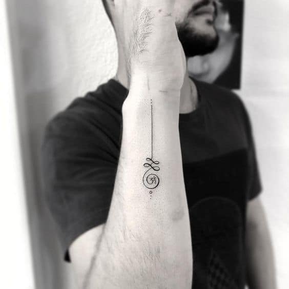 Unalome tattoo with an Om symbol on the forearm, representing spiritual awakening, inner peace, and the journey to enlightenment.