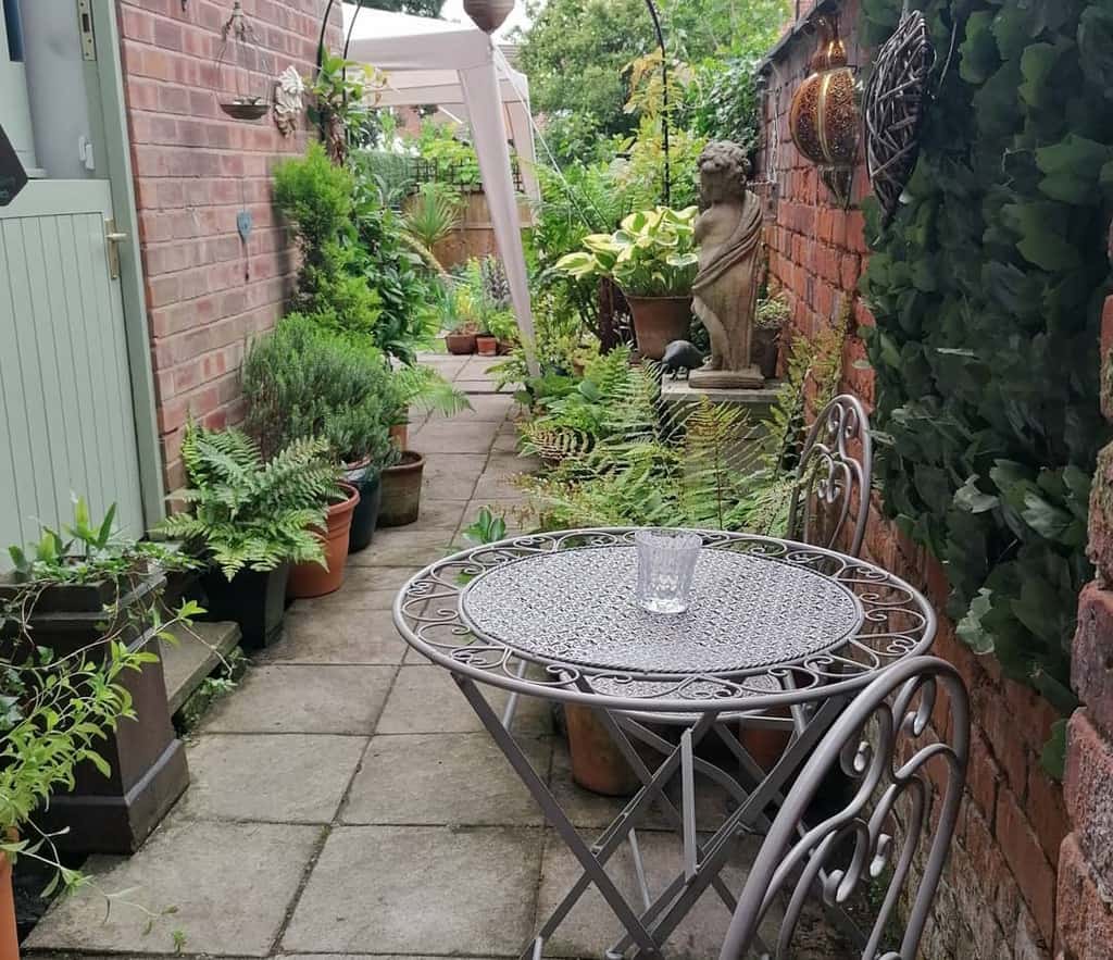side yard paved patio with table and chairs 