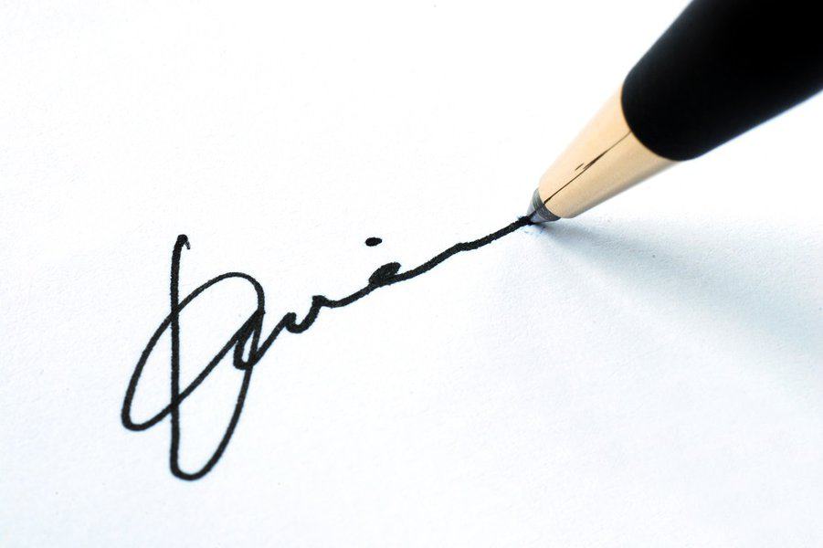 sign paper with a pen