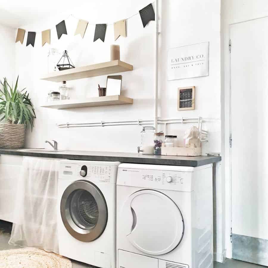 white farmhouse style laundry with washer and dryer 