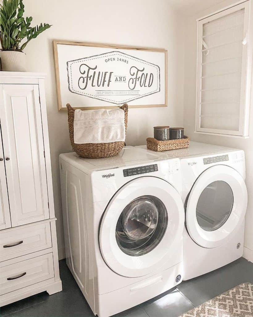 white washer and dryer laundry white cabinet 