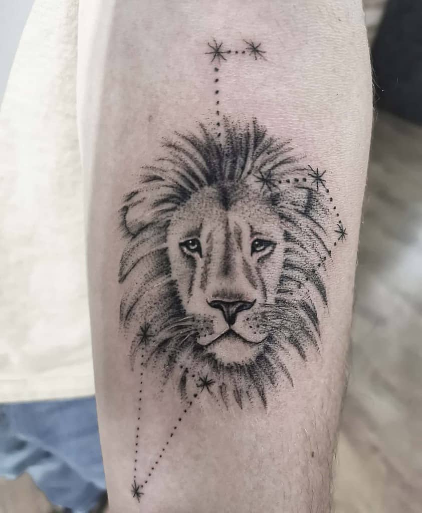 Leo zodiac tattoo with a majestic lion’s face and constellation mapping, representing courage and cosmic energy.