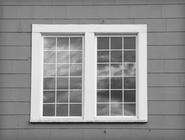 simple white craftsman exterior window trim gray wall