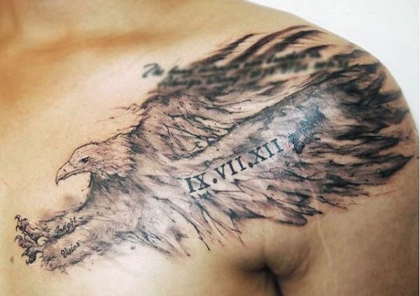 Tattoo of a detailed flying eagle with Roman numerals and text on a person's chest and shoulder