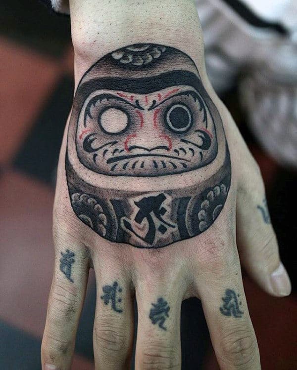 Simple Black And Grey Ink Daruma Doll Male Hand Tattoos