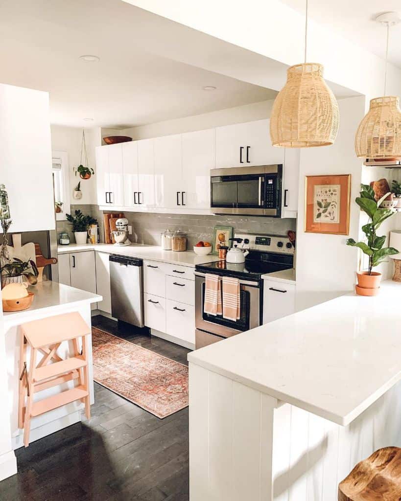 Modern farmhouse kitchen with white cabinetry, natural wood accents, woven pendant lights, and cozy decor elements.